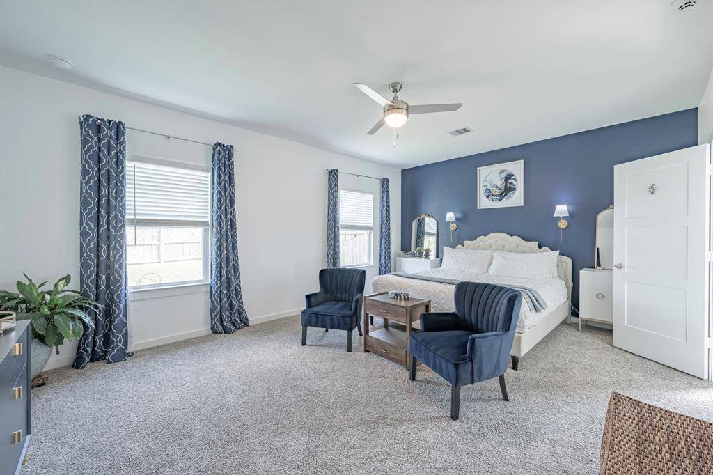 Retreat to the tranquil primary suite located privately on the main floor.