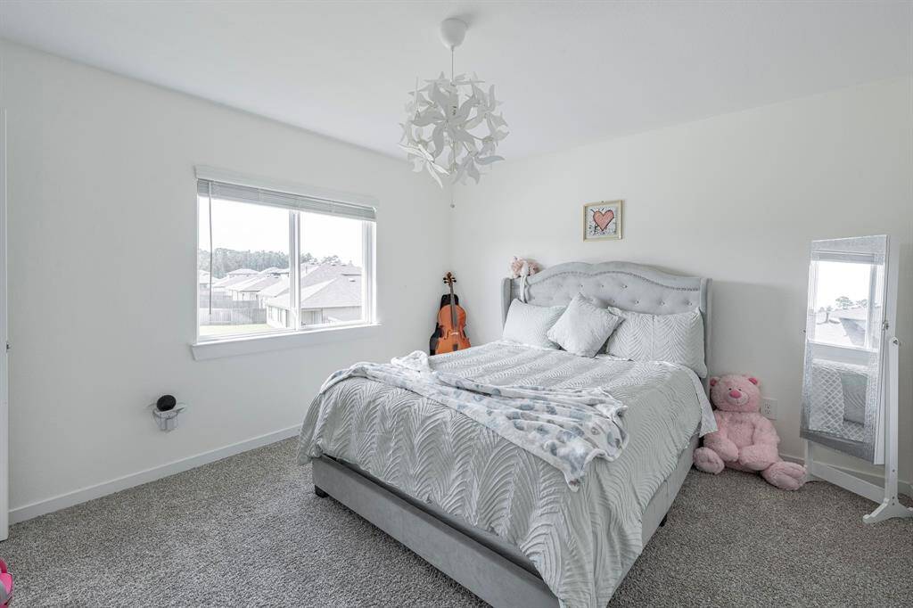 Each upstairs bedroom offers comfort, natural light, and generous closet space.