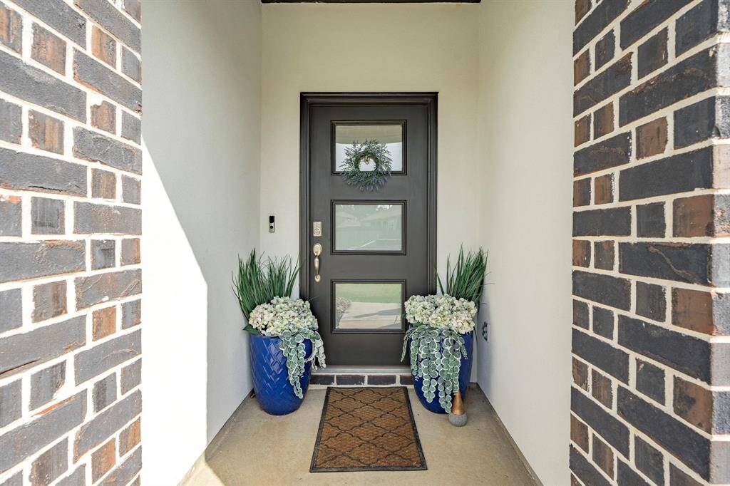 Covered front entry offers a warm welcome with room for seasonal décor.