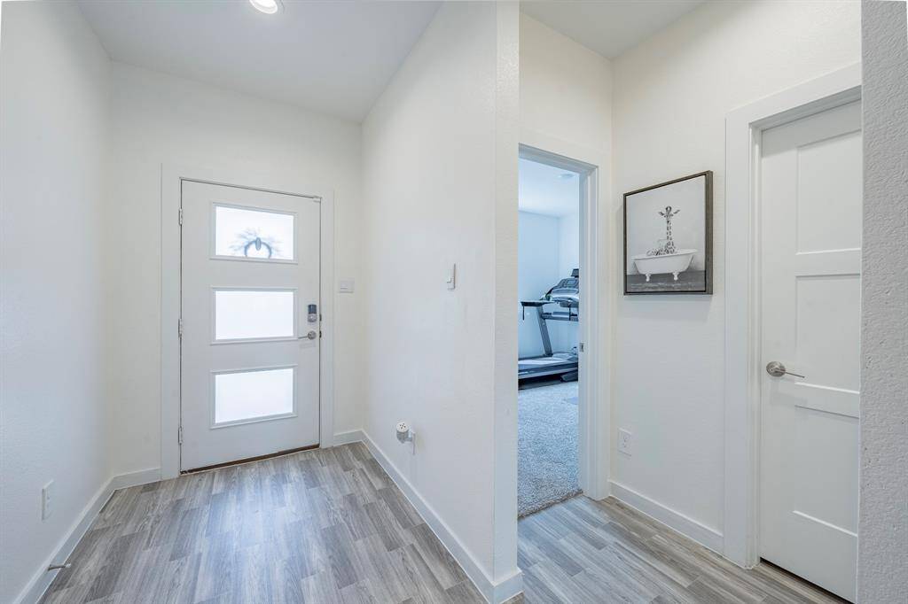 Step inside to a bright and open foyer with sightlines to a flexible downstairs bedroom or office.