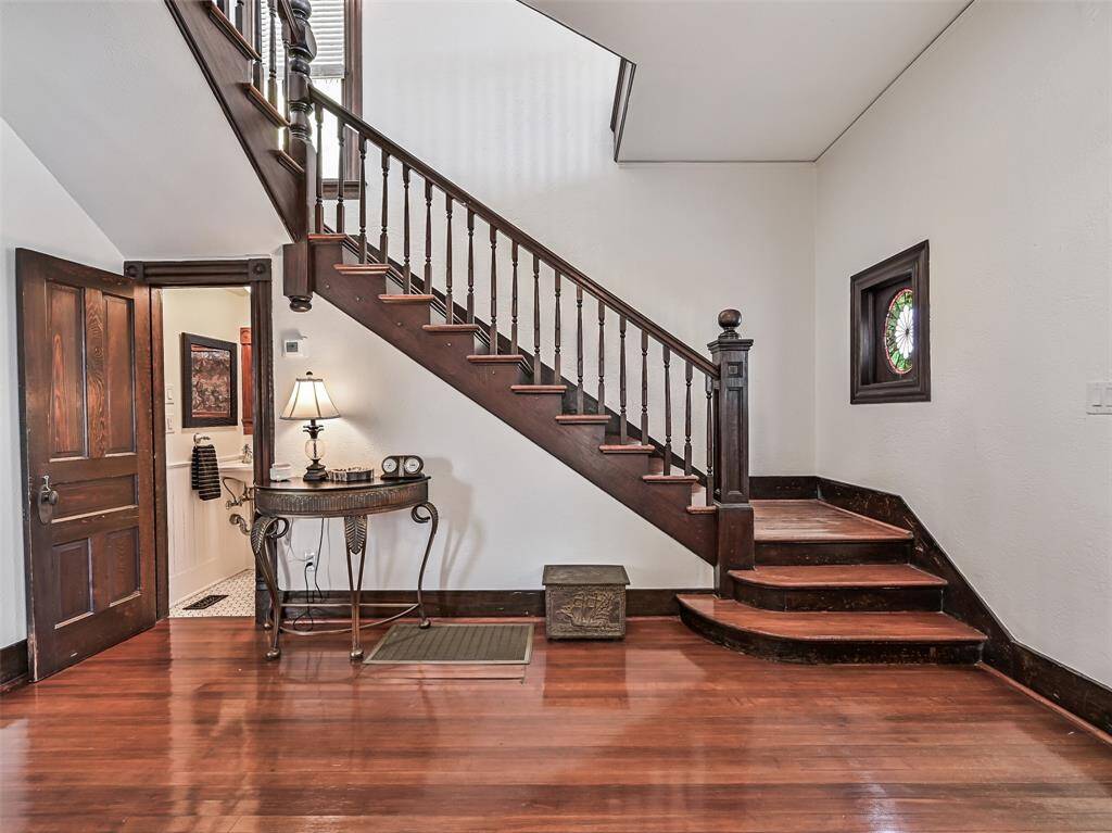 Front entry looking at half bath and staircase.