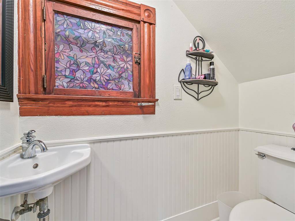 Half bath under the stairs.