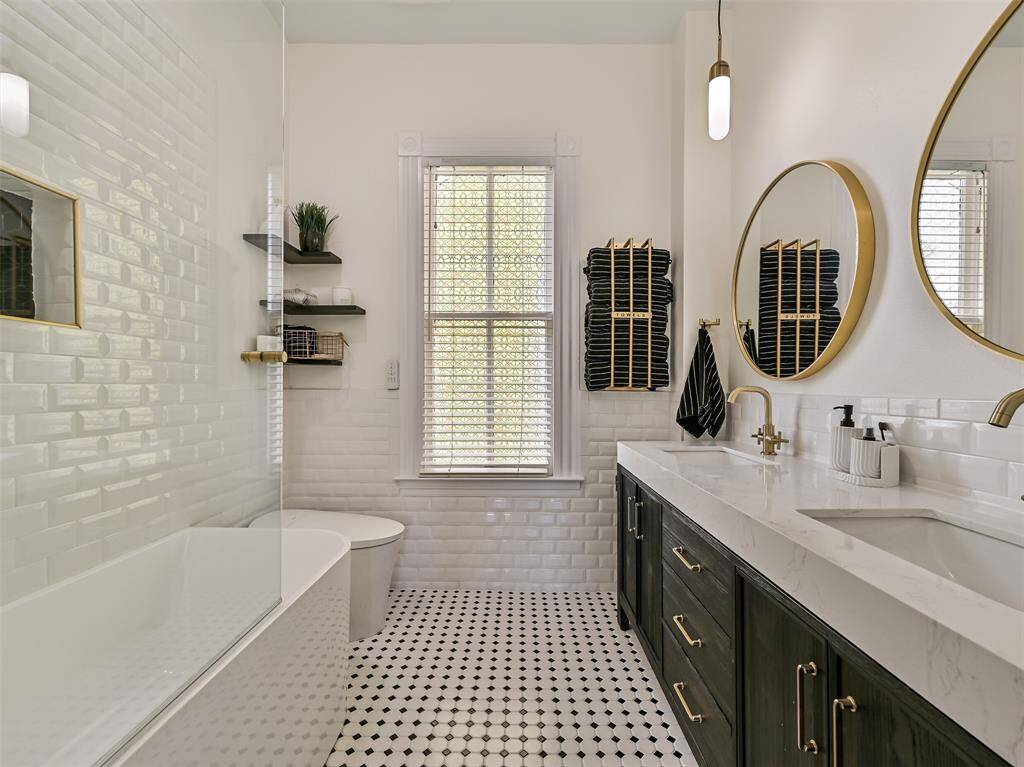 Upstairs full bathroom with a blend of modern and vintage charm.