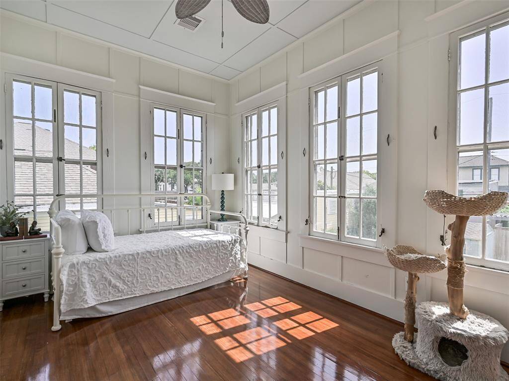 Enclosed sleeping porch can either be a bedroom or additional home office.