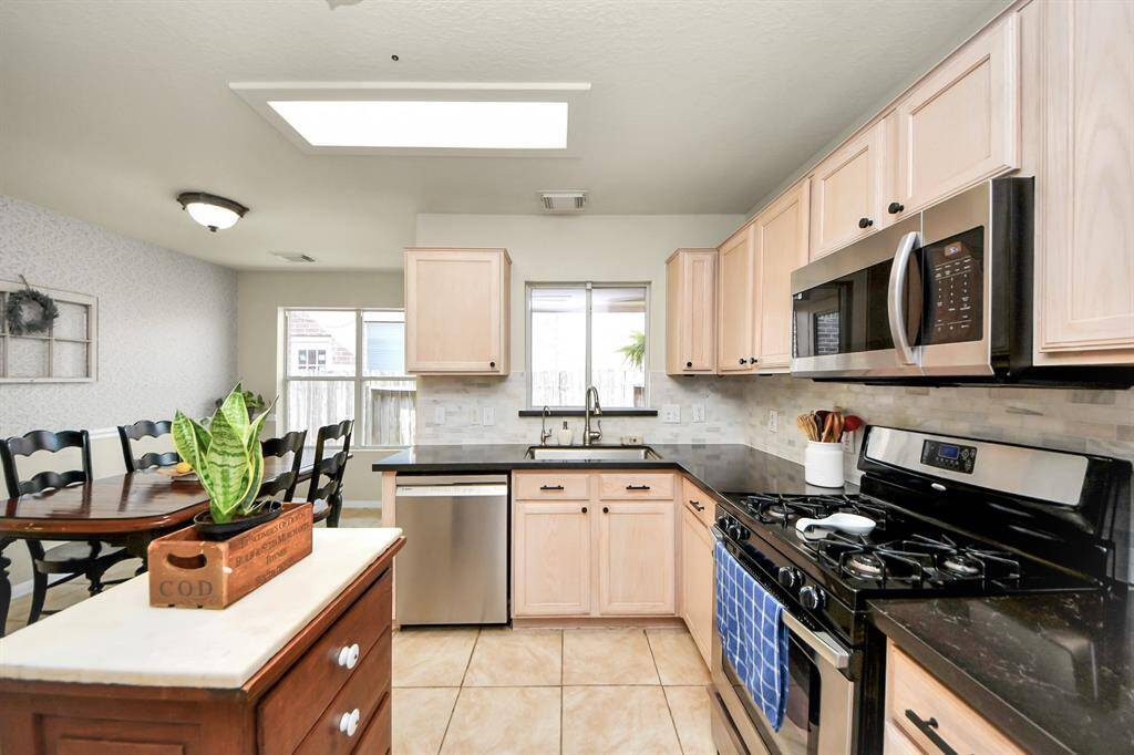 Bright and inviting, this space is perfect for everyday cooking and entertaining. Please note: the kitchen island is not included with the home.
