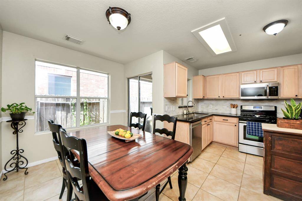Enjoy casual meals in the cozy breakfast dining area, perfectly situated just off the kitchen for added convenience.