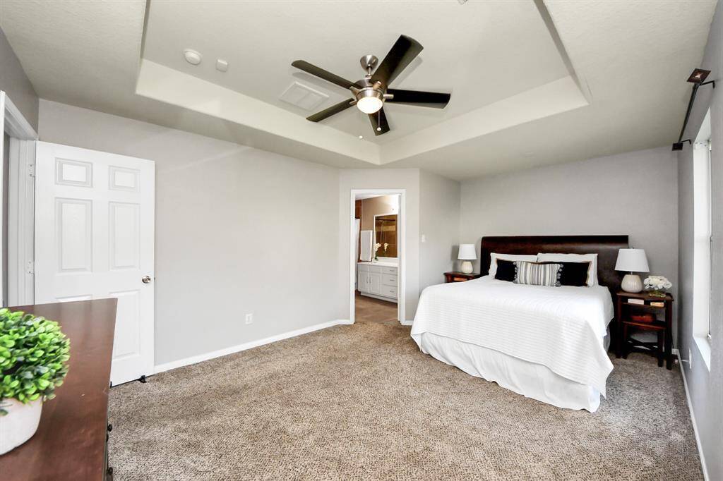 This inviting space includes an ensuite bathroom, offering comfort and privacy with a seamless blend of style and functionality.