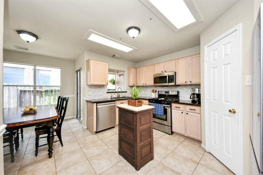 Enjoy casual meals in the cozy breakfast dining area, perfectly situated just off the kitchen for added convenience.