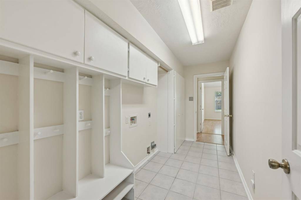 Laundry room with backpack nook