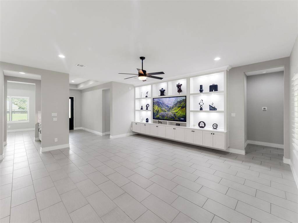 Artisan-crafted built-in entertainment wall, a striking centerpiece with integrated storage for form and function