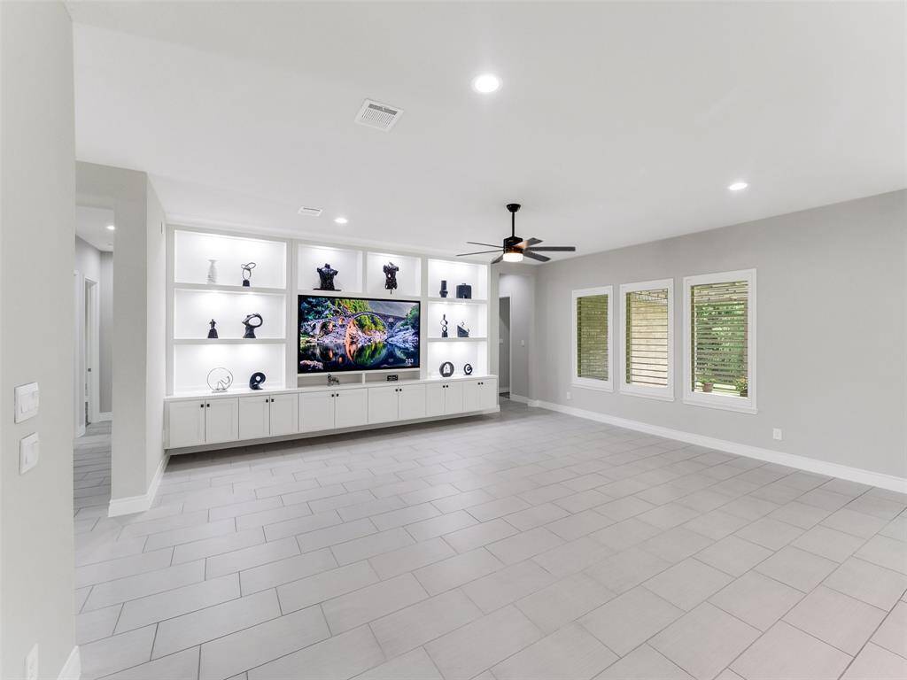 Artisan-crafted built-in entertainment wall, a striking centerpiece with integrated storage for form and function
