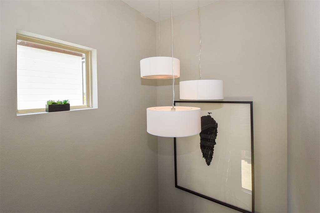 Custom light fixture in staircase.