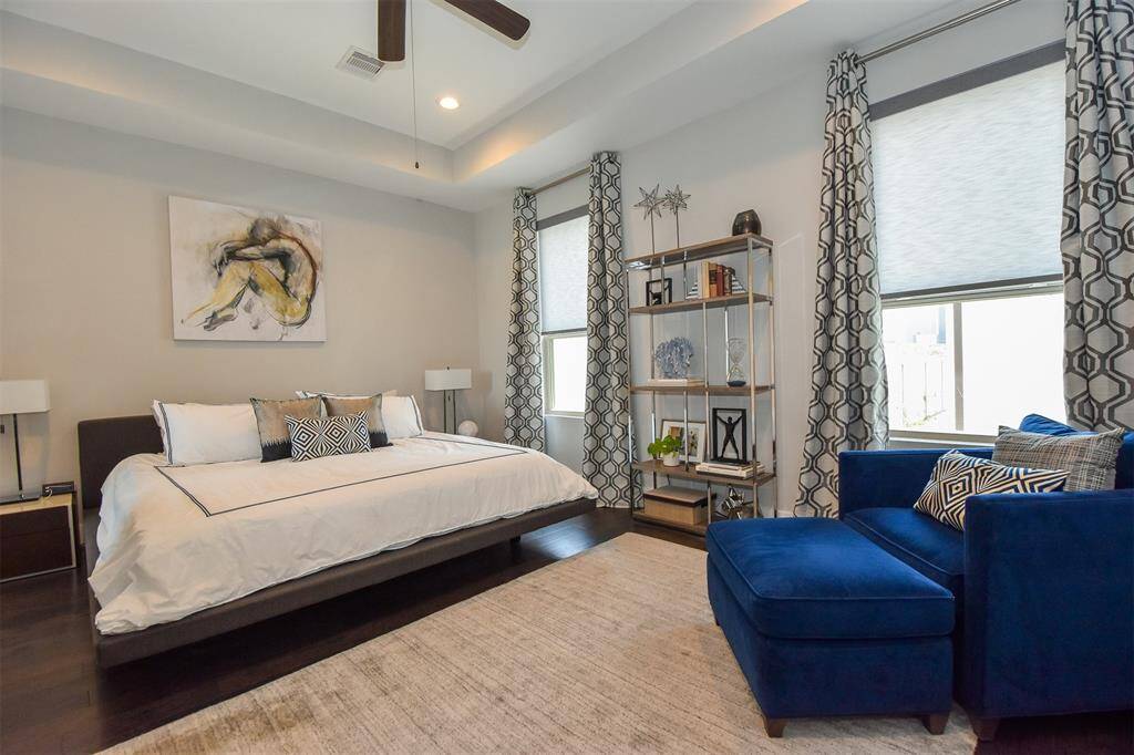 Master Bedroom with ceiling fan on third floor.