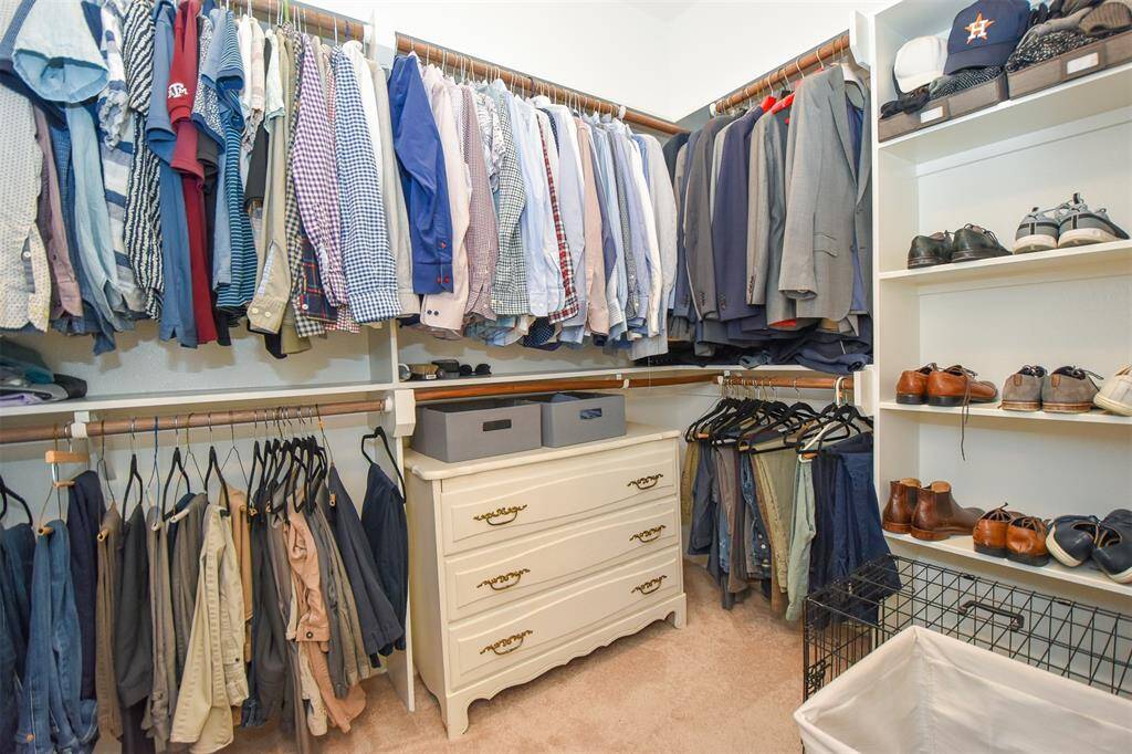 Walk in Master Closet with built in shelves.