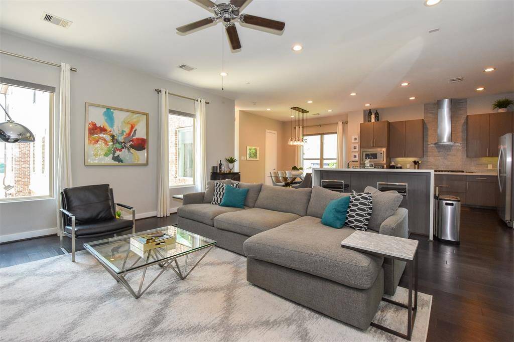 Notice all abundance of natural light coming from all the large windows.