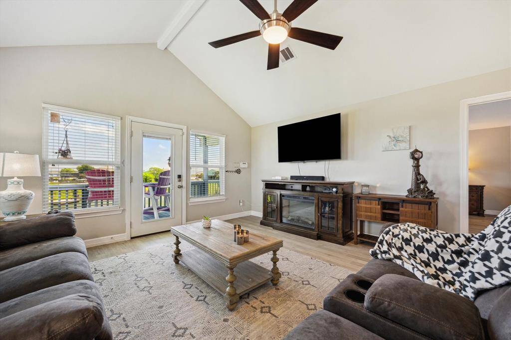 Here's a closer peek at your living room. You can see the pond and you can also pick up a little bit of the bay if you look in the right spot. This room is easy to decorate and furniture placement is a breeze.