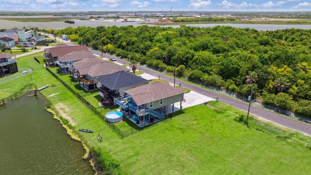 There are two vacant lots beside you that are owned by the developer and this lot has the best views of the pond. The pond is maintained by a neighbor and everyone cuts the grass behind their fences to help pitch in since there's not an active HOA and no fees are paid. Dickinson Bayou and Salt Bayou are in the background.