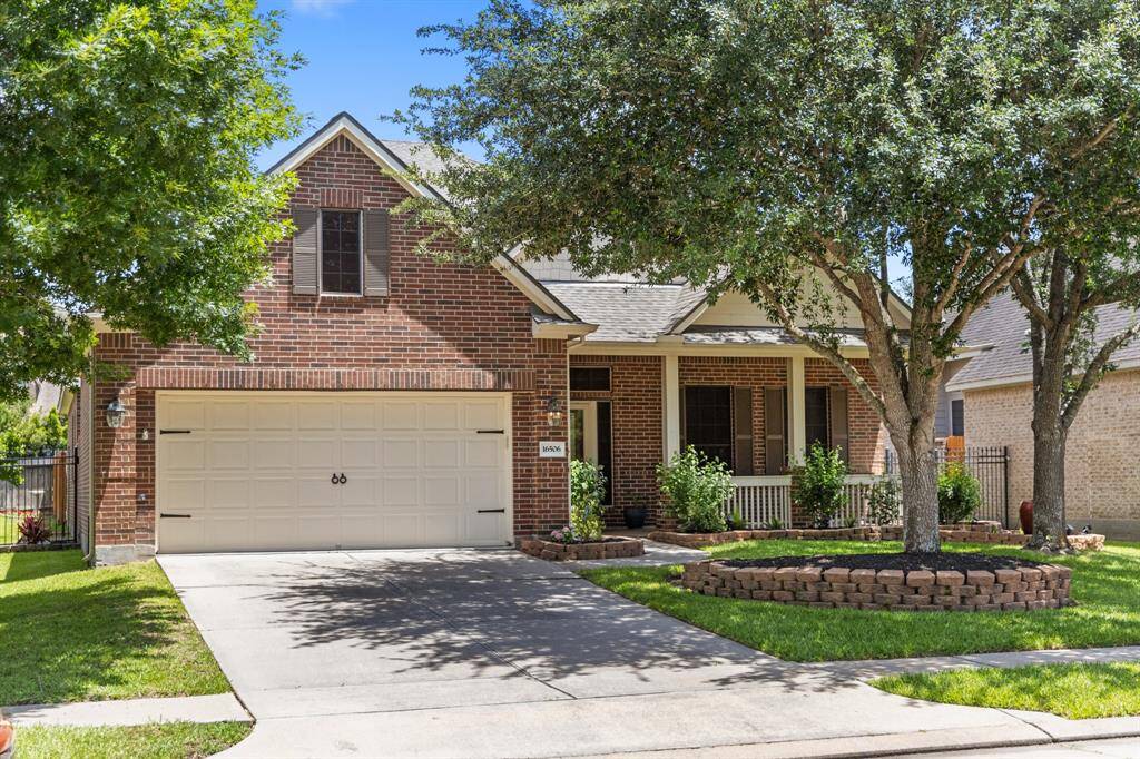 Located to the left of the entrance, the large 2-car garage offers ample space for vehicles and storage. Clean lines and durable materials enhance the exterior appeal.