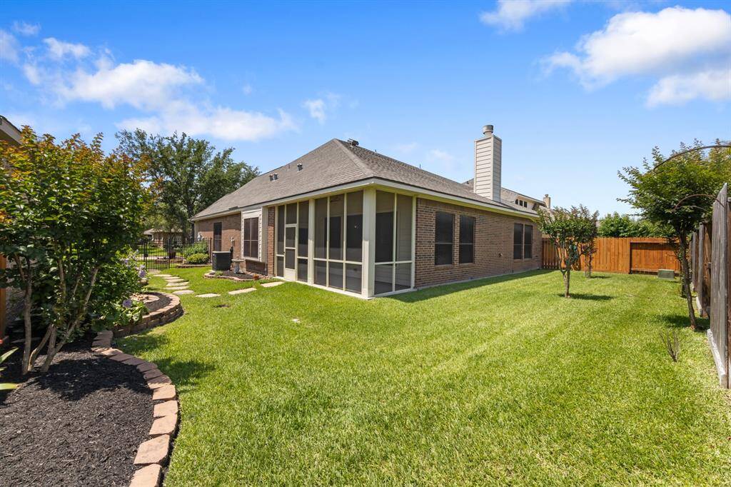 The beautifully landscaped backyard offers plenty of open space, perfect for kids and pets to play. Lush greenery and thoughtful design create a serene outdoor to relax or appreciate beautiful summer afternoons.