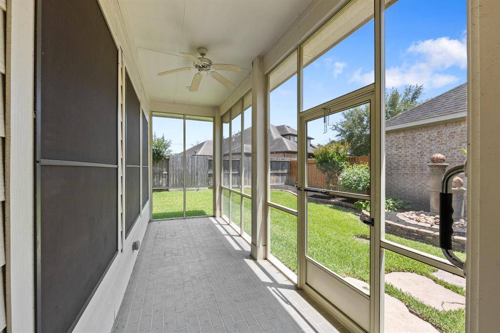 The enclosed covered patio provides a  perfect place for relaxing or entertaining year-round with added privacy and protection from the elements.