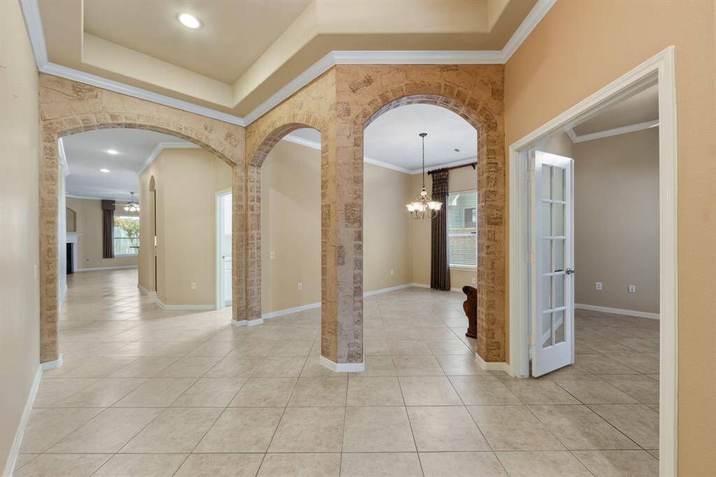 The entry boasts elegant tile flooring that flows seamlessly throughout the home.