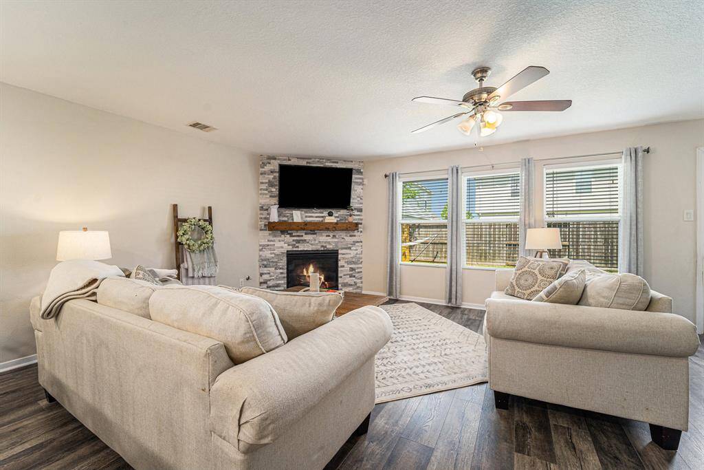 Updates include fireplace stonework and mantle