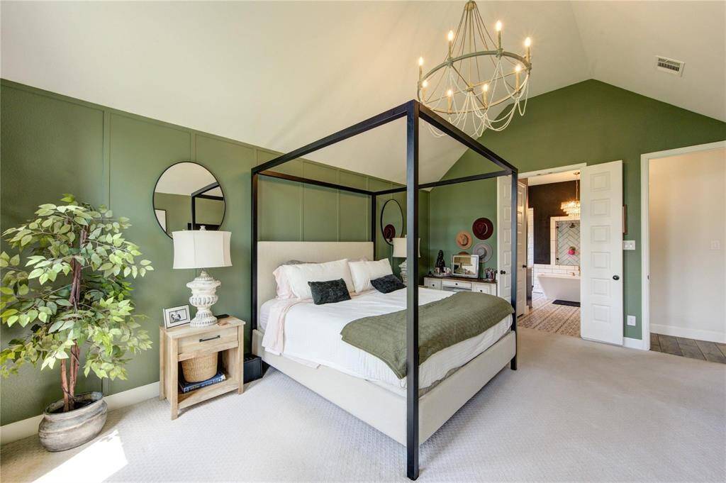 The primary suite has plenty of space and natural light.