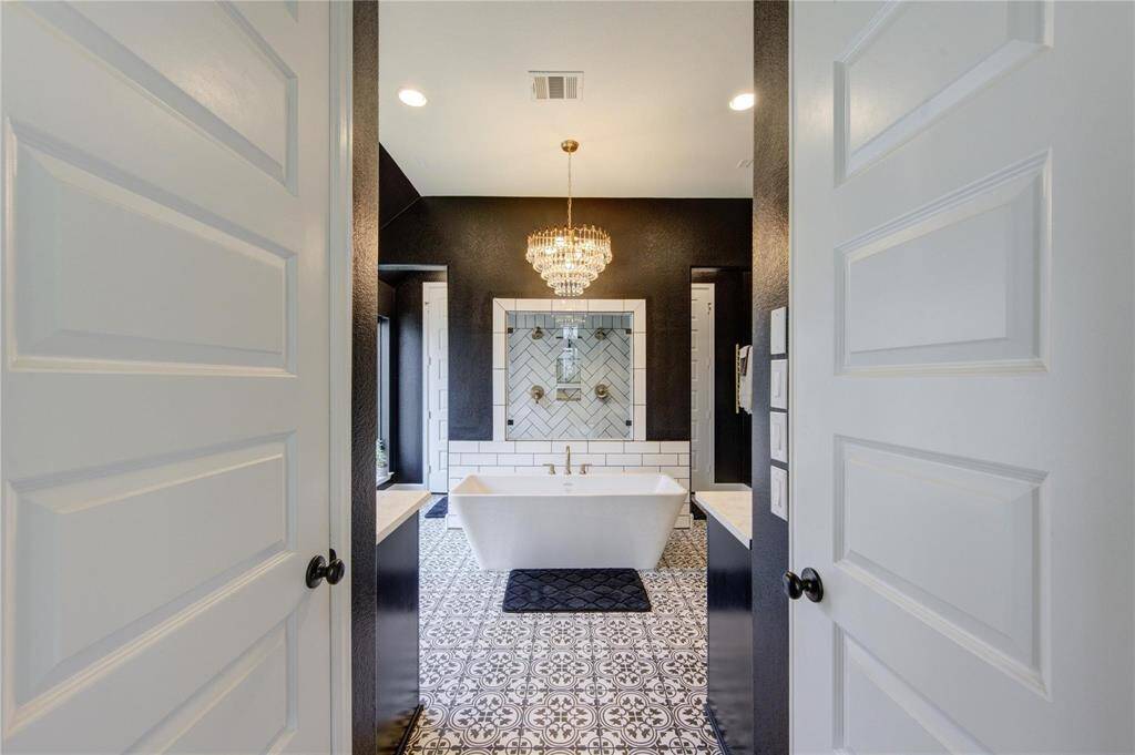 Enter the primary bathroom in all its elegance