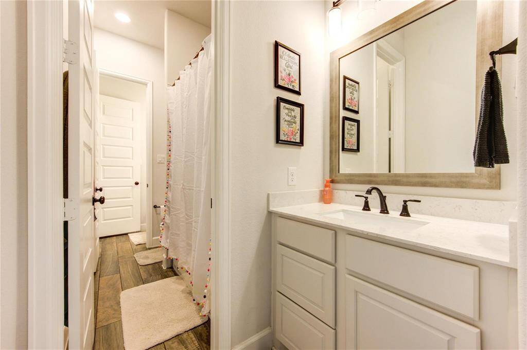 Elegant third bathroom perfect for guests or family use.