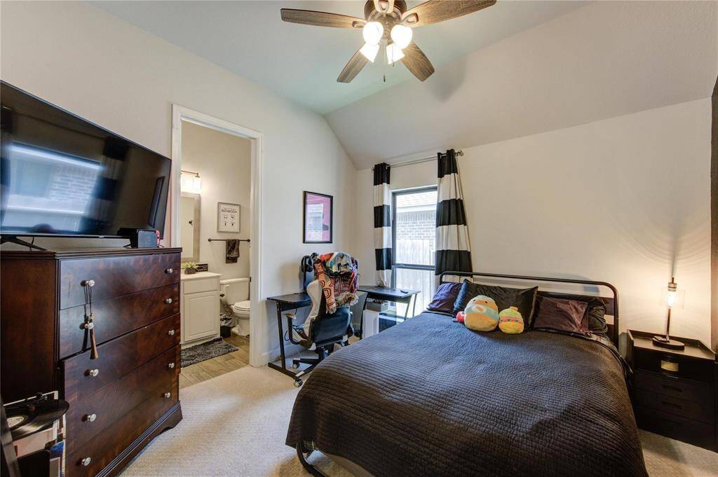 4th bedroom with attached bathroom, featuring ample natural light and a versatile layout.
