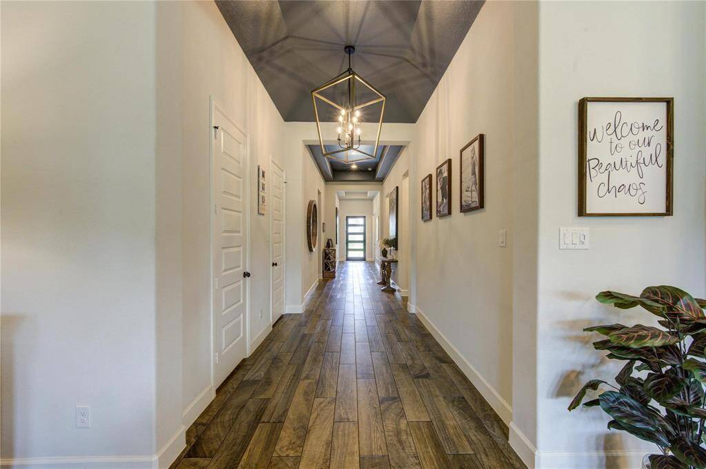Welcome home! This widened but elegant hallway welcomes all residents and visitors, setting the tone for a warm and inviting space.