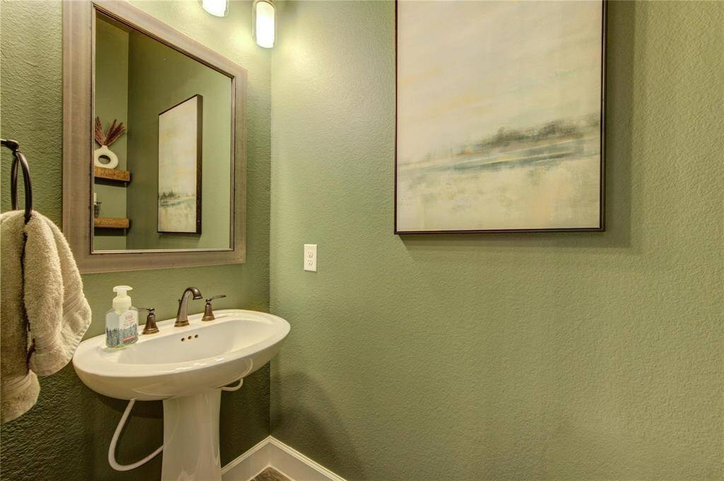 Powder bathroom located off the main hallway.