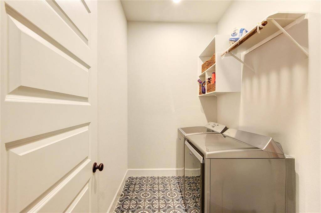 Large laundry room with storage for product and space for hanging clothes