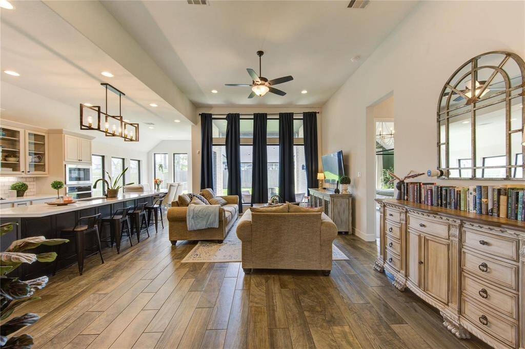 Experience spacious elegance in this livingspace with soaring ceilings and expansive windows that flood the room with natural light.