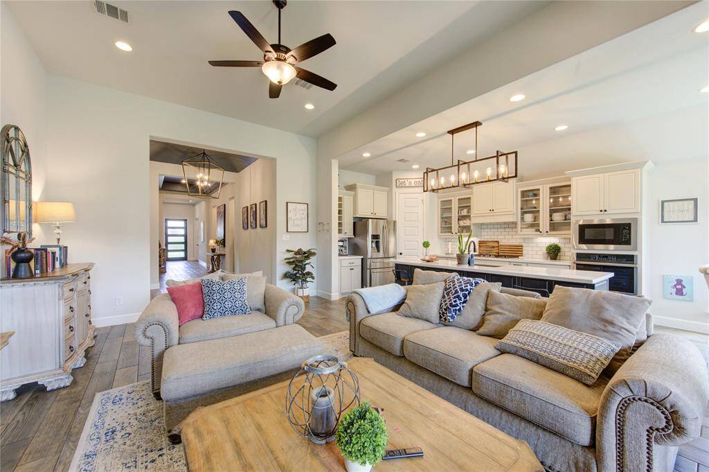 Tall ceilings and open floor plan design enhance the comfort of this space