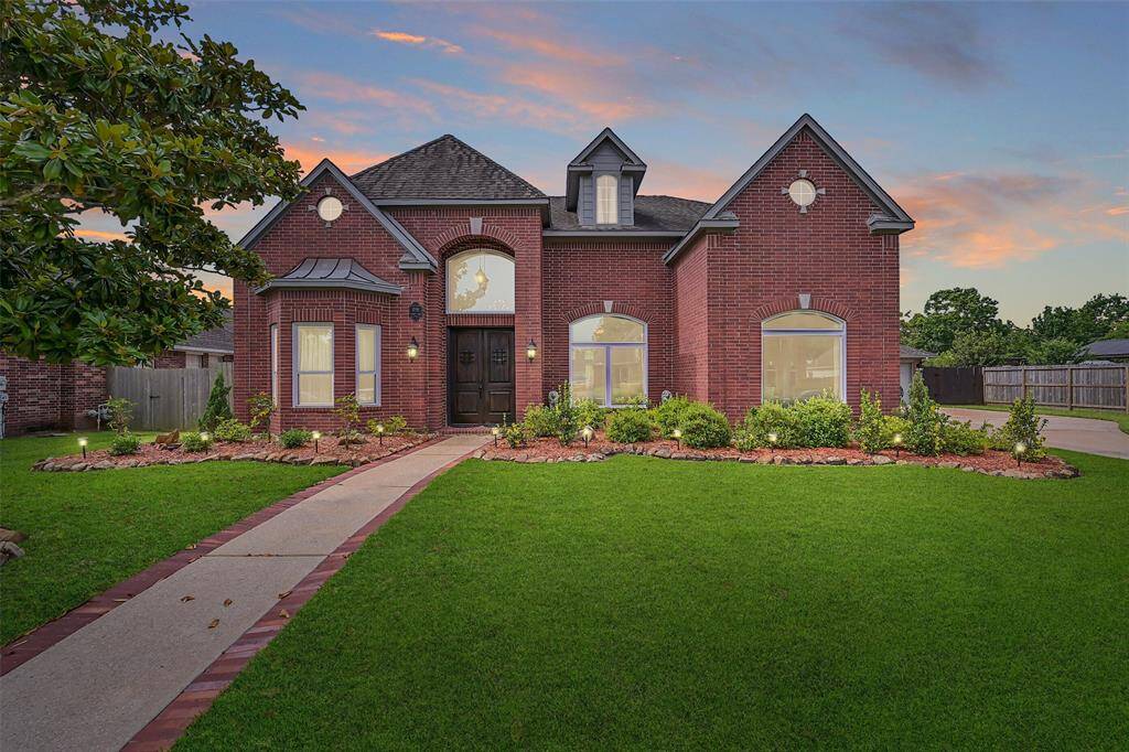 Elegant red brick façade with manicured landscaping, dramatic arched entry, and rare 5-car garage in prestigious Boca Raton! Situated in highly acclaimed Friendswood ISD, this 4,226 SF home blends timeless curb appeal with exceptional space and design.