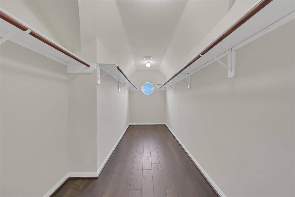 Storage is abundant throughout the home, including this impressive 15' x 7' walk-in storage room—ideal for seasonal items, luggage, or keeping your home beautifully organized.
