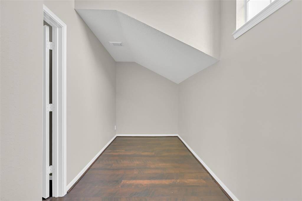 Storage is abundant throughout the home, including this impressive 15' x 7' walk-in storage room—ideal for seasonal items, luggage, or keeping your home beautifully organized.