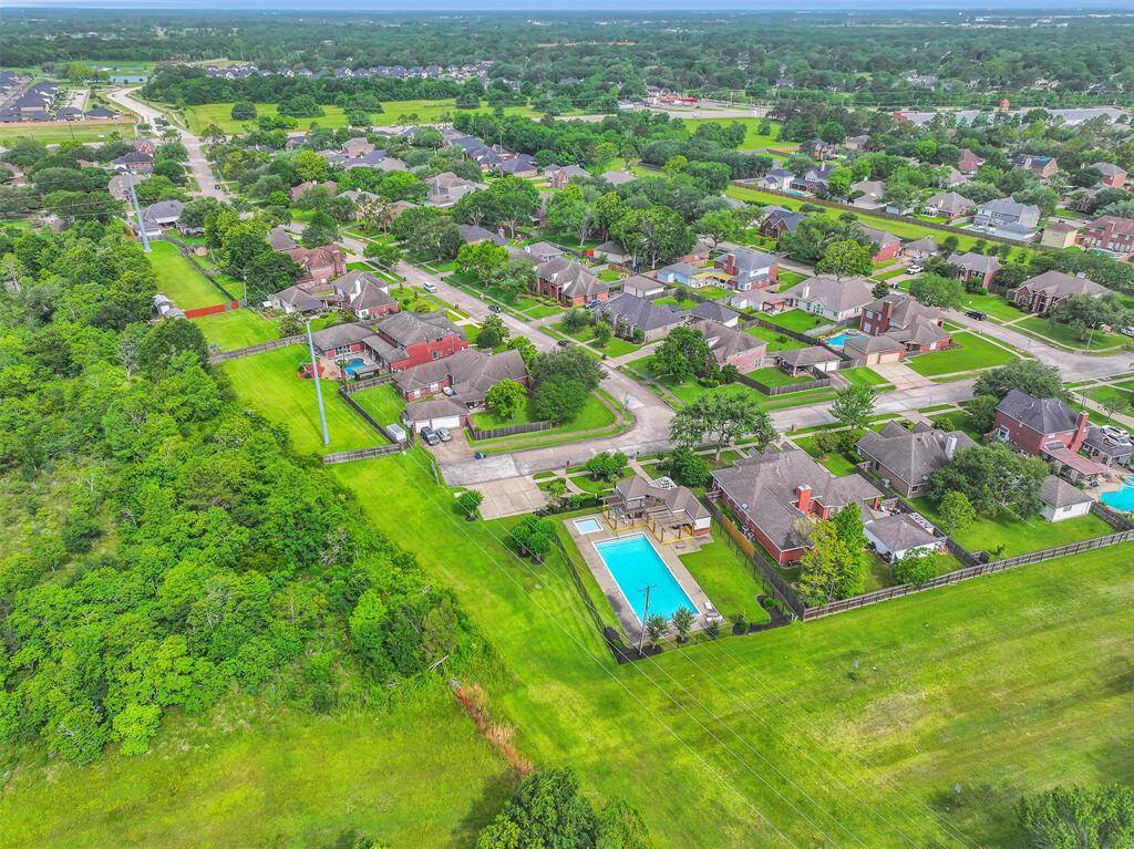 Exceptional location in the heart of Boca Raton, backing to a lush greenbelt with no rear neighbors. Enjoy unmatched privacy while still being moments from community amenities, schools, and conveniences.