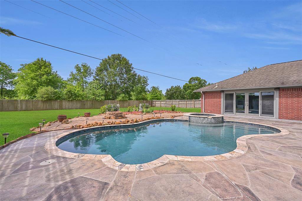 Enjoy the expansive view over this impressive 0.58-acre property—plenty of space to relax, garden, or entertain. The oversized backyard offers endless possibilities with its manicured lawn, thoughtful landscaping, and total privacy with no rear neighbors in sight.
