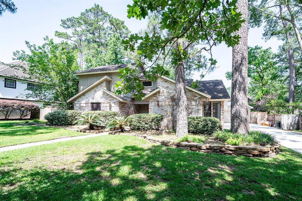 Nestled among majestic trees, this home offers serene natural beauty and privacy.