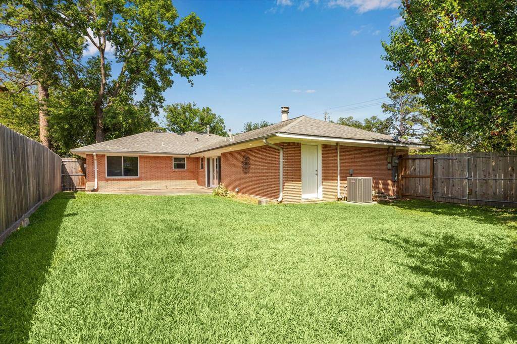 Expansive backyard is perfect for entertaining or gardening.