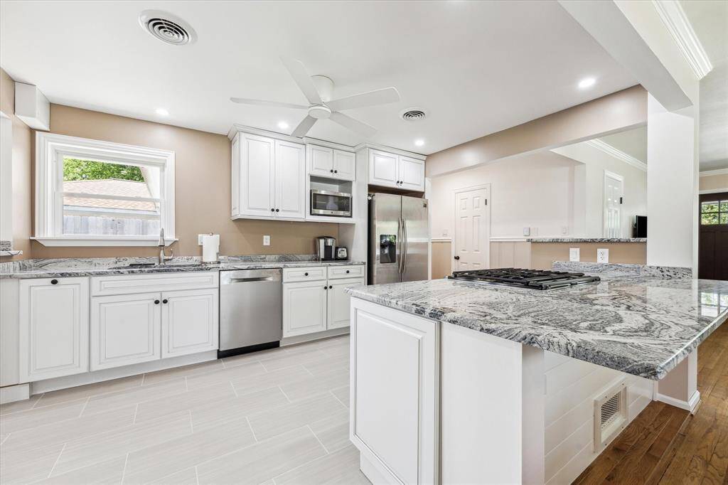 Granite countertops with backsplash in kitchen