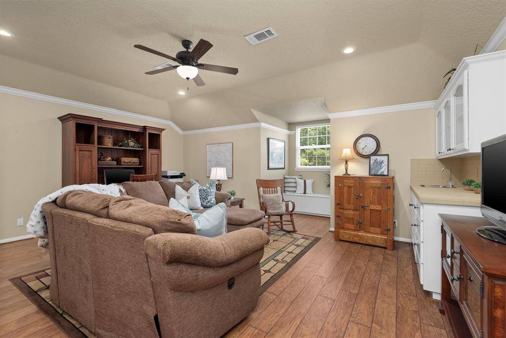 Upstairs Gameroom - Spacious upstairs game room with built-in cabinetry, wet bar, and plenty of room for lounging, entertaining, or movie nights.