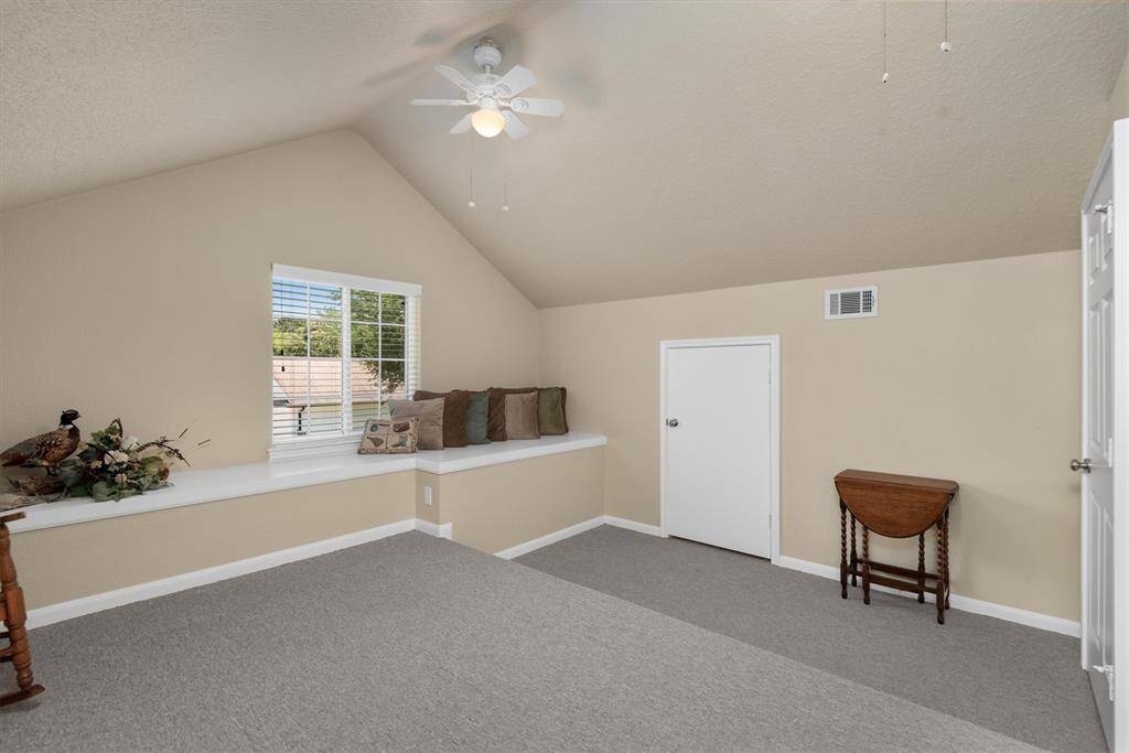 Upstairs Flex Room - Flexible upstairs bonus room—ideal for a craft area, workout space, storage, or home office with access to attic storage.