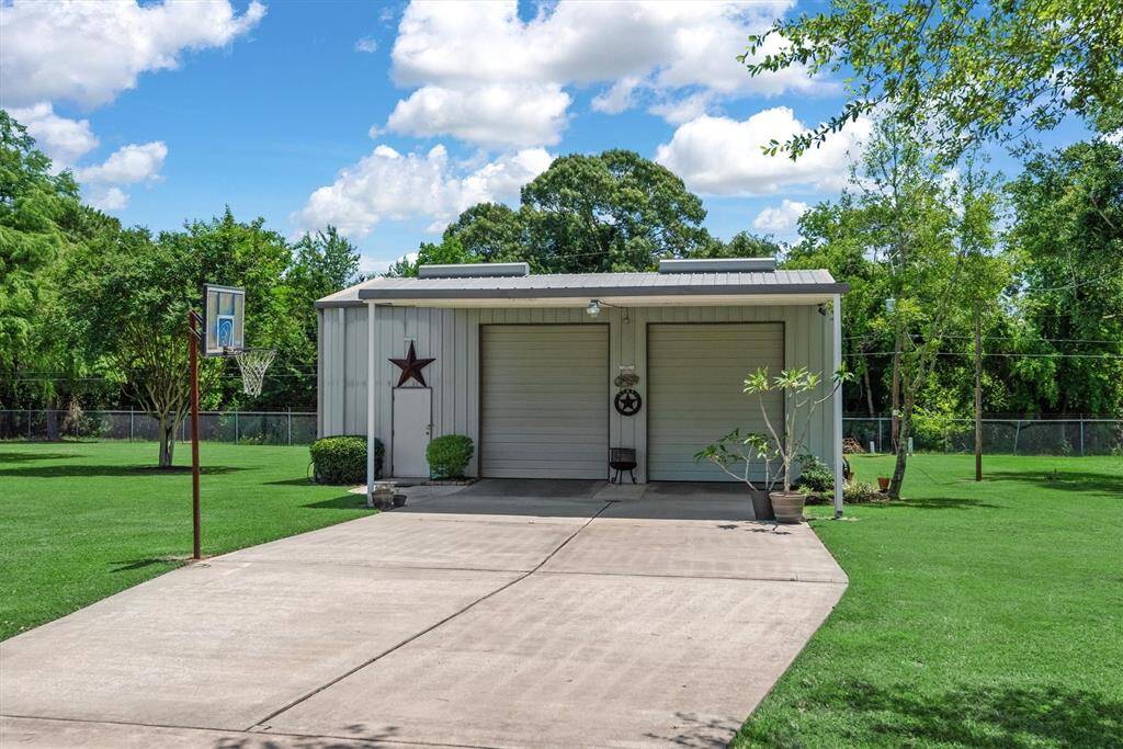 Impressive 40x50 barn featuring a dedicated workshop area, kitchen, half bath, three roll-up doors, one double-wide door, and one walk-through doors—ideal for hobbies, projects, storage, or entertaining.