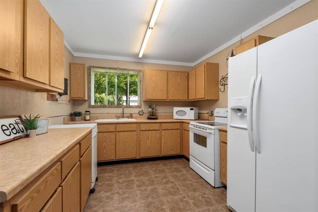 Fully equipped kitchen inside the barn, perfect for preparing meals, hosting gatherings, or supporting your next project or event with ease. Features portable dishwasher, electric oven/stove, microwave, sink and ample counter space. (Fridge excluded)