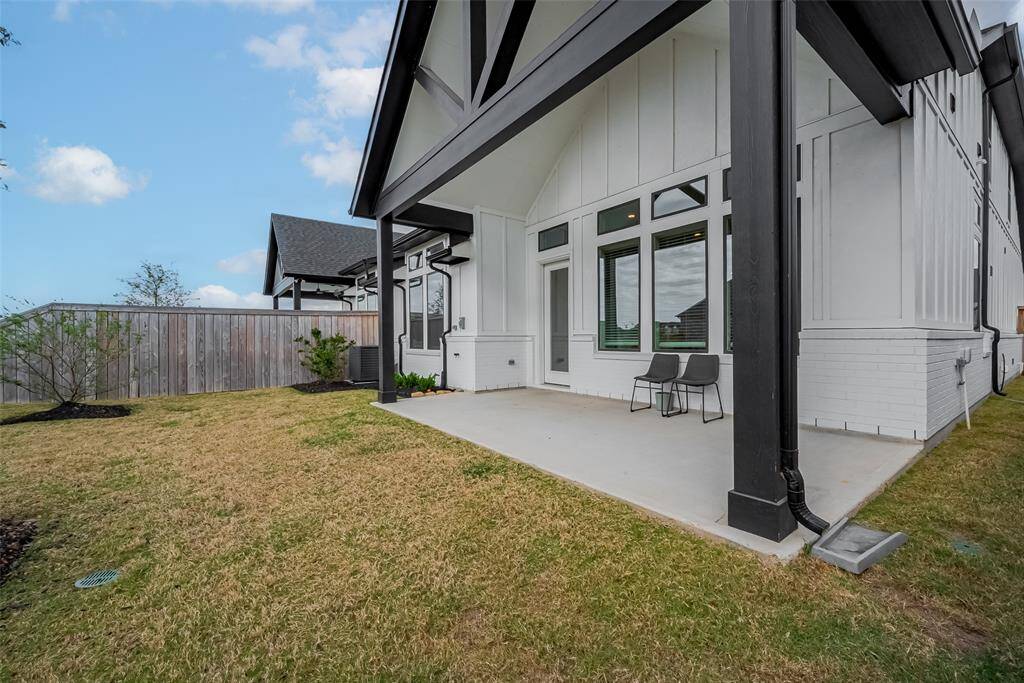 A spacious, covered patio perfect for outdoor relaxation and entertainment.