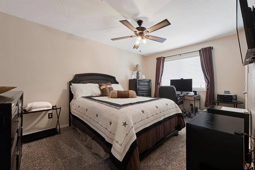 Cozy and inviting, this secondary bedroom features ample natural light and perfect for relaxation or hosting guests.