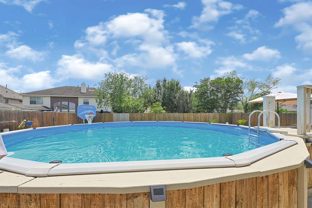 Enjoy ultimate relaxation in this inviting above-ground pool.